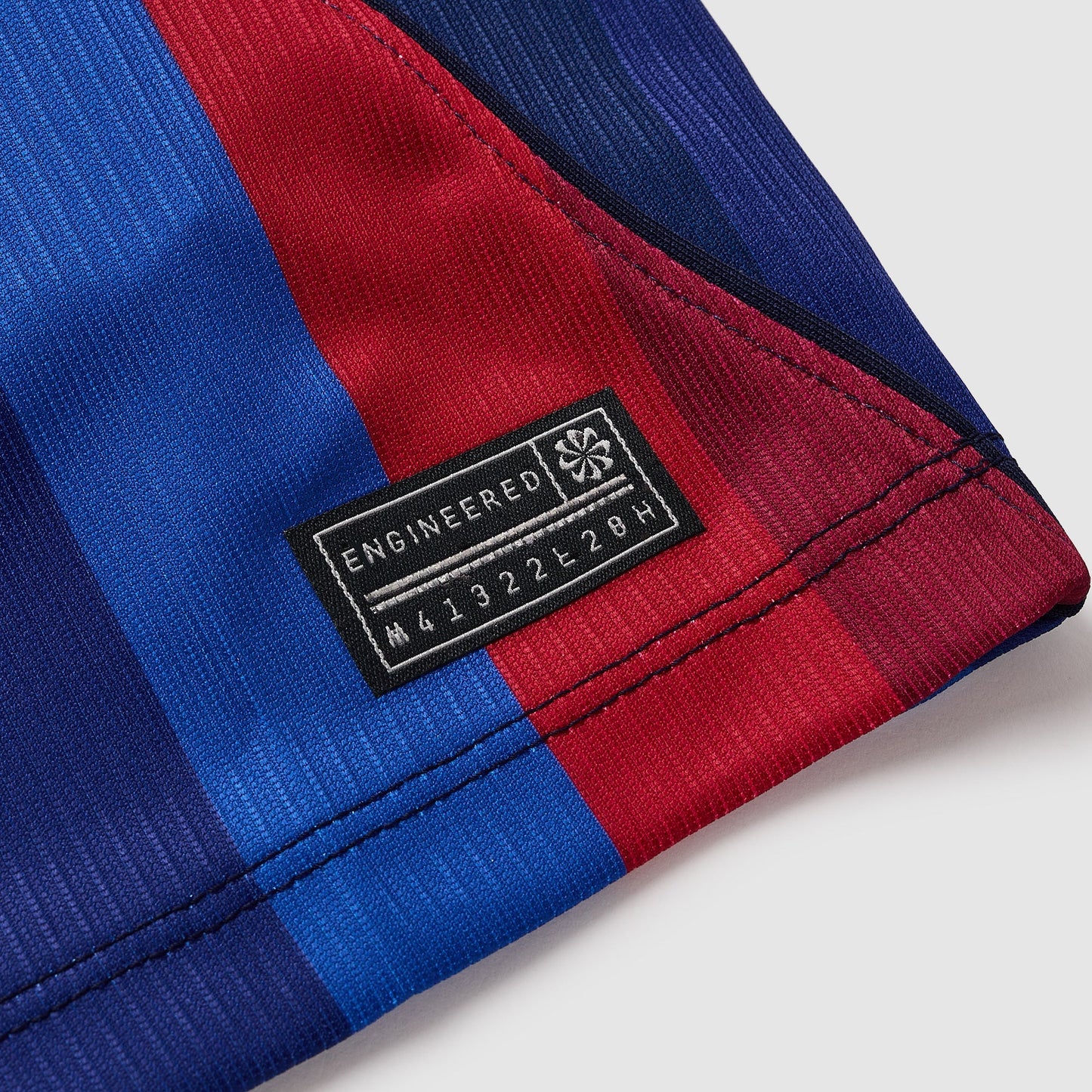 Barcelona 26/27 Home Kids Kit - engineered hem label detail