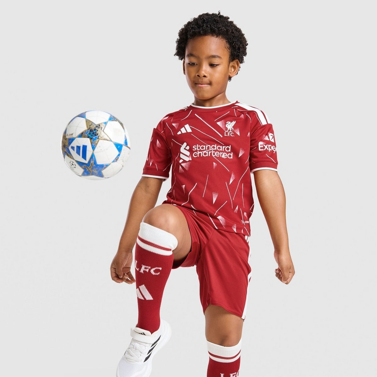 Liverpool 26/27 Home Kids Kit - worn by model with ball