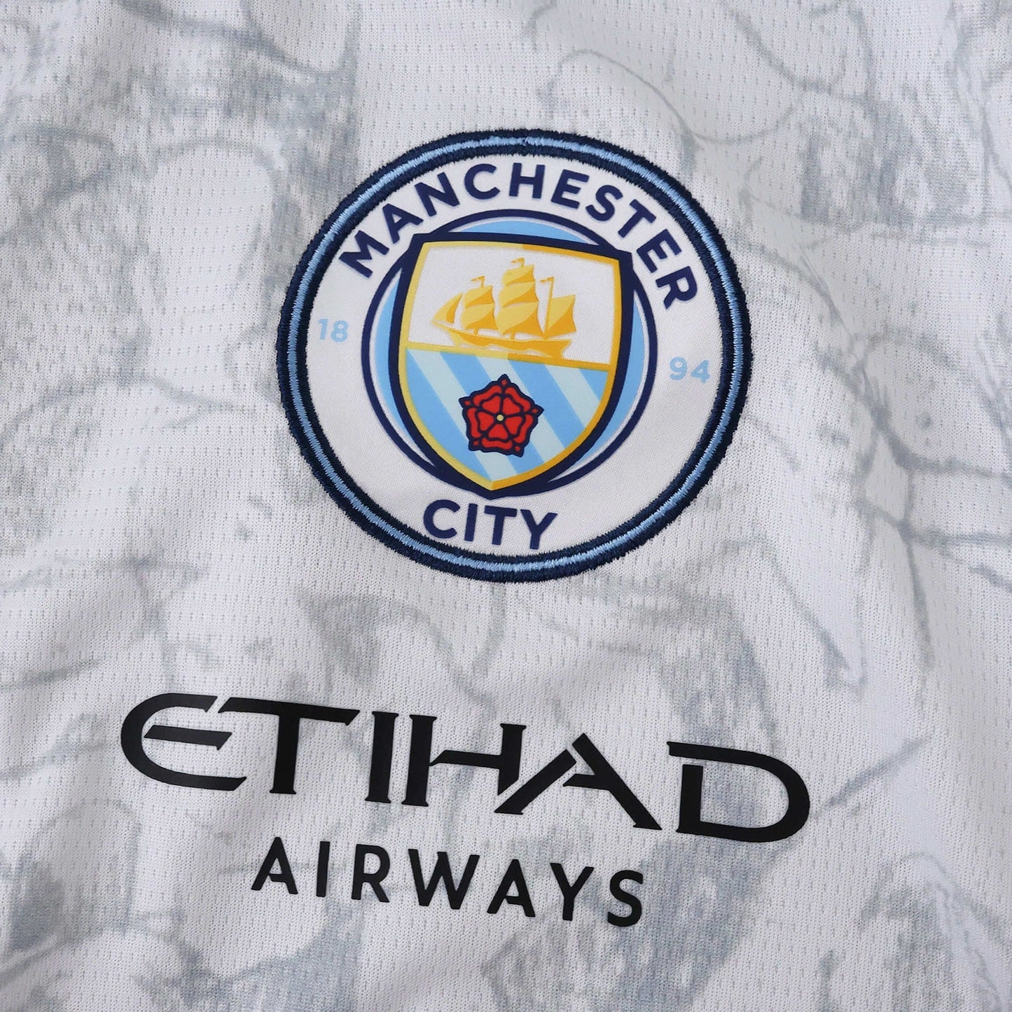 Manchester City 25/26 x KidSuper Jersey - crest and sponsor detail